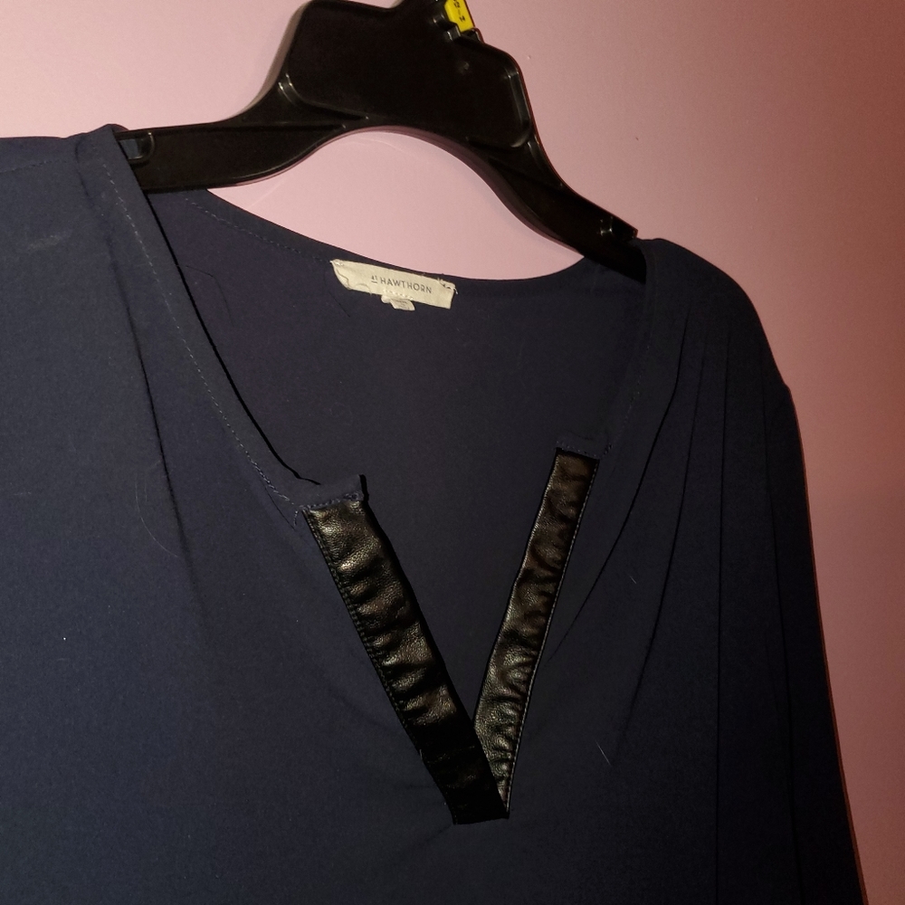 Dark blue shirt with leather accents.